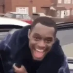 Black fat guy laughs in the car meme (1)