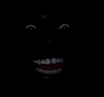 Guy laughing in dark