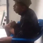 man clapping on chair and making a beat