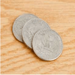 1 coin dropped on a table