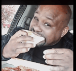 man eats pizza and gets excited
