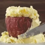 Smear meat with butter