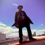 "nonchalantly grabs chair"