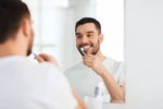 GUY BRUSHING TEETH