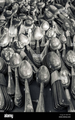Person throwing up spoons