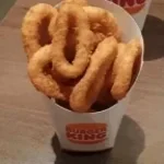 finding an onion ring in his fries