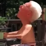 Grandpa gets water poured on his back