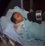 baby coughing into microphone